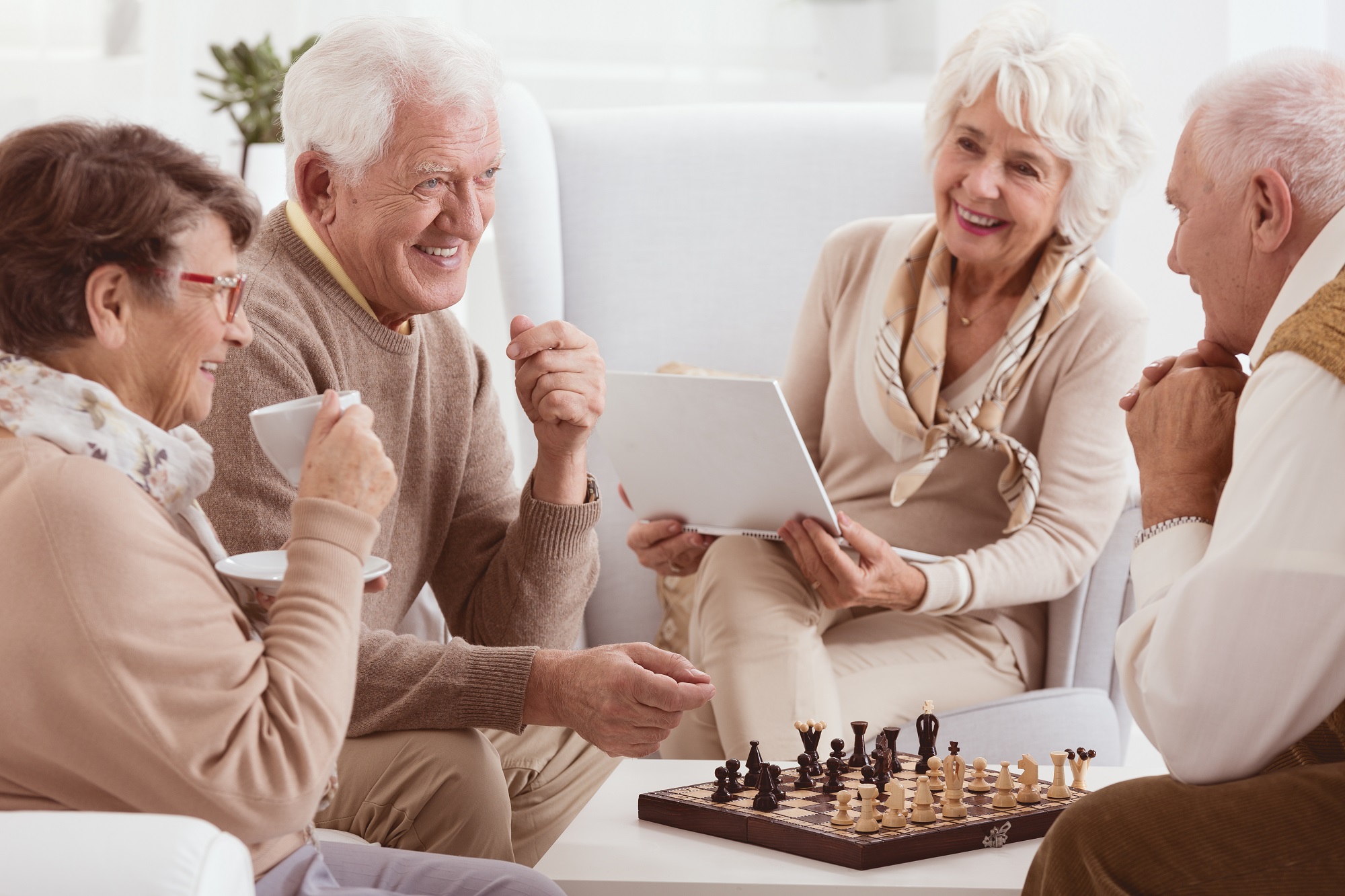 Activities Seniors Playing Chess | Heritage Waterside Seniors Playing Chess And Laughing