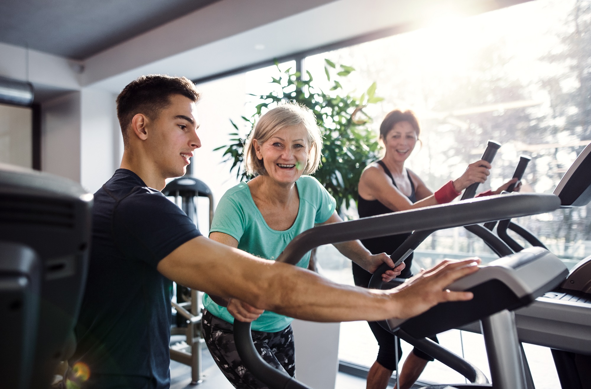 Activities Two Female Seniors Assisted By A Trainer | Heritage Waterside Two Female Seniors Assisted By A Trainer