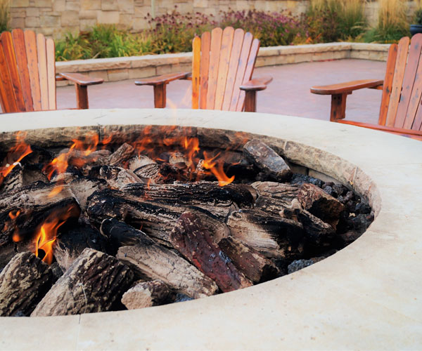 Firepit Surrounded By Adirondack Chairs | Heritage Waterside Fire Pit