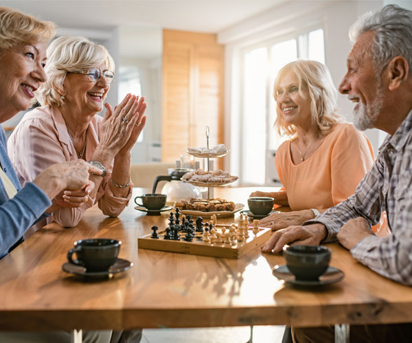 Game Room Seniors Playing Table Chess | Heritage Waterside Other Activities Room
