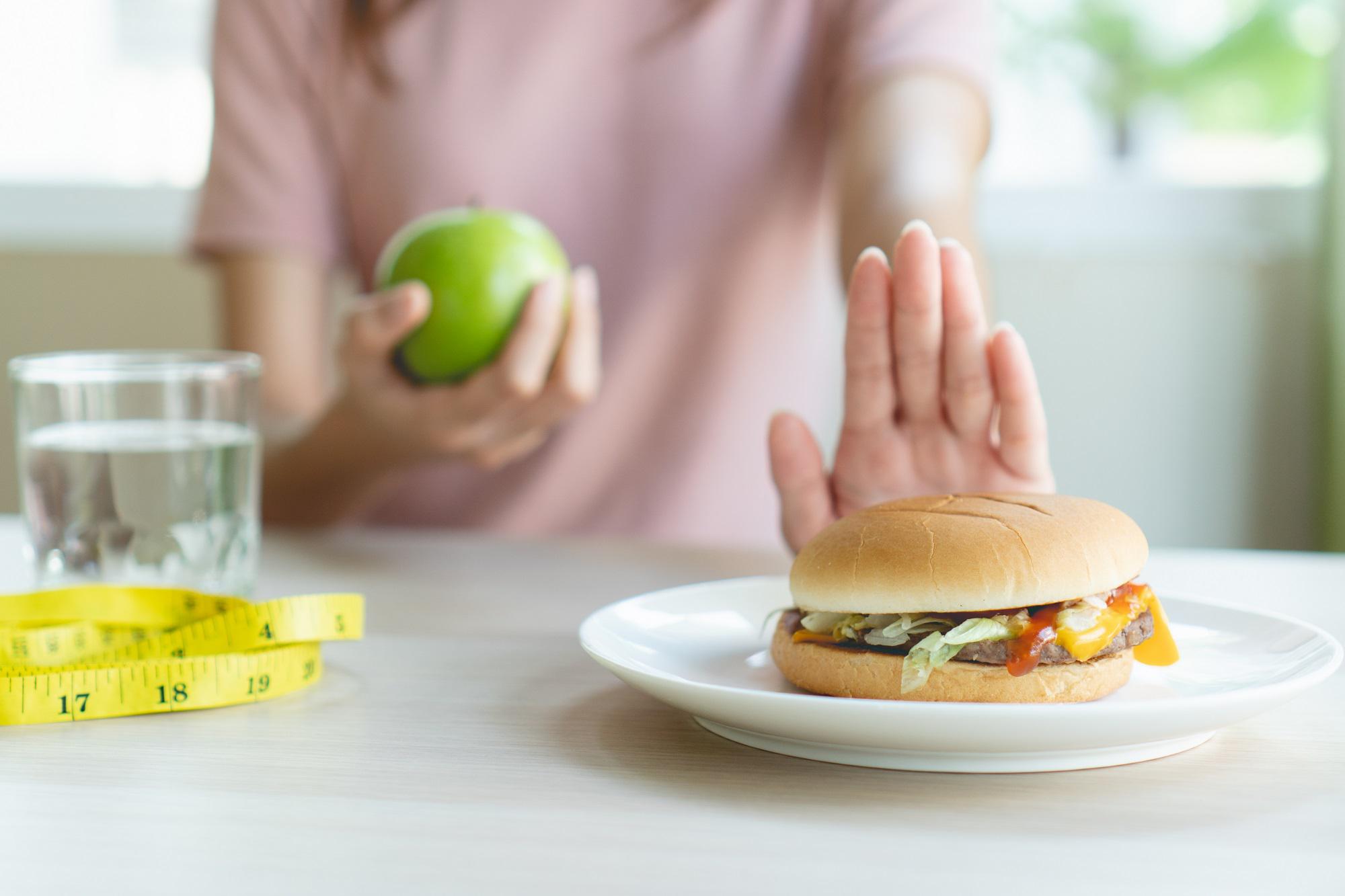 Woman Refusing Junk Food | Bahama Bay