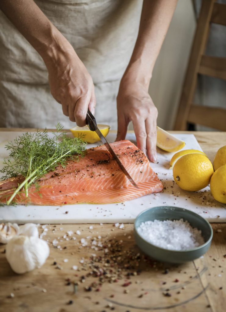 Chef Cutting Salmon | Bahama Bay