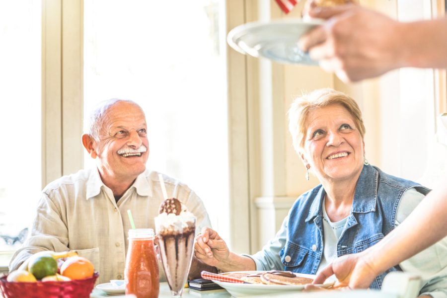 Our Approach Image 2 Pr6Jstf9M2Eqsqo2Drkm0K5H0T28J30E4Gclb42Zjk | Heritage Waterside Senior Living Couple Served With Food | Bahama Bay